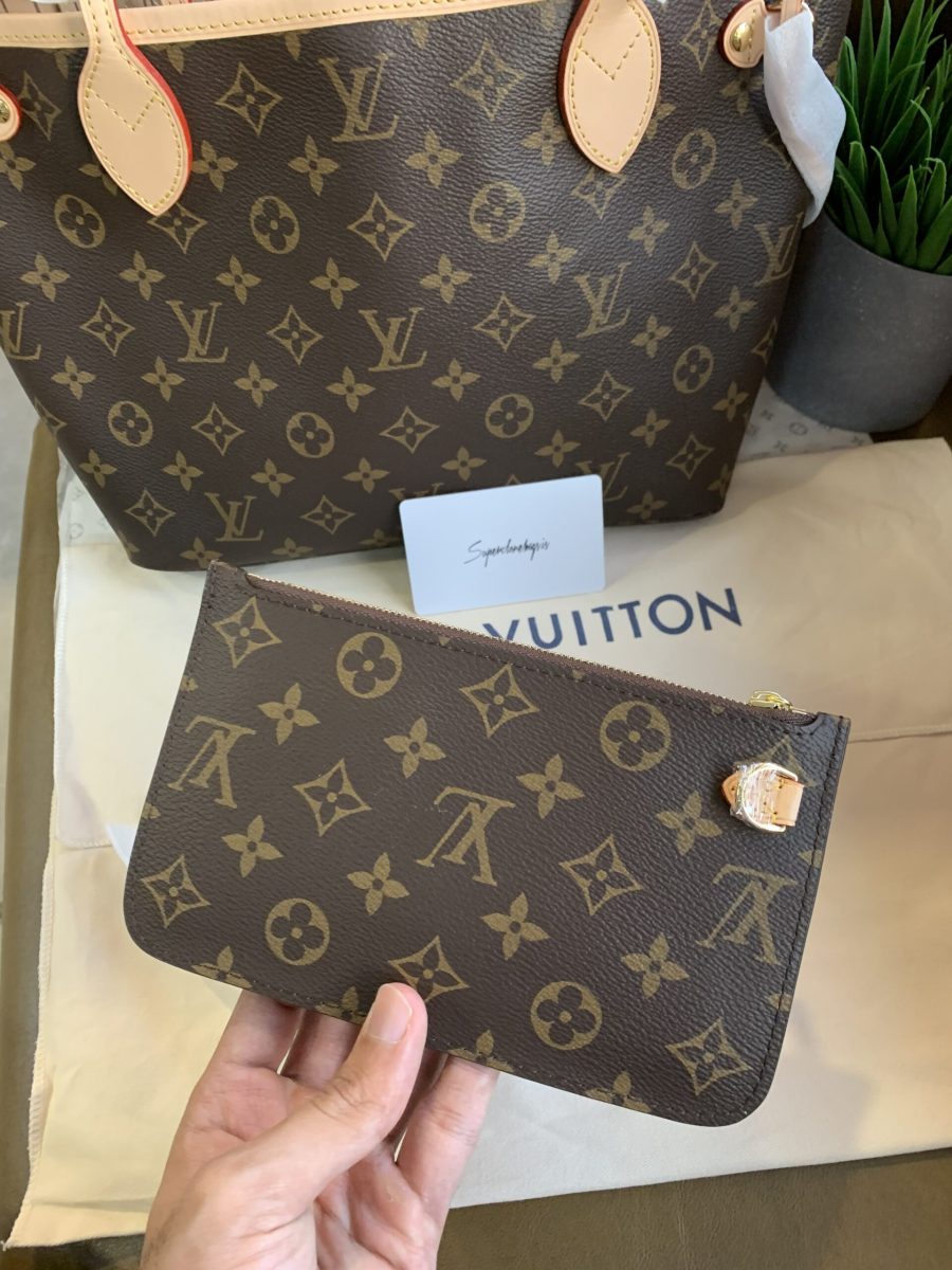 Detailed stitching on natural cowhide leather handles of Neverfull PM