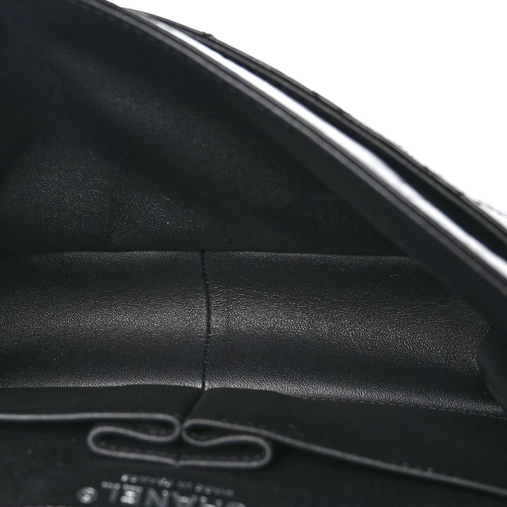 Interior view of the Large 2.55 Reissue 226 flap bag with leather lining and multiple storage compartments