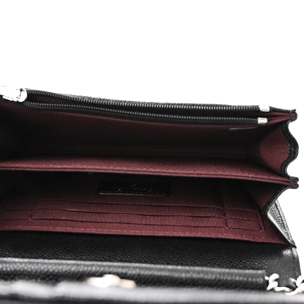 Interior view of the Mini Wallet On Chain with leather lining, card slots, zip pocket, and organized storage