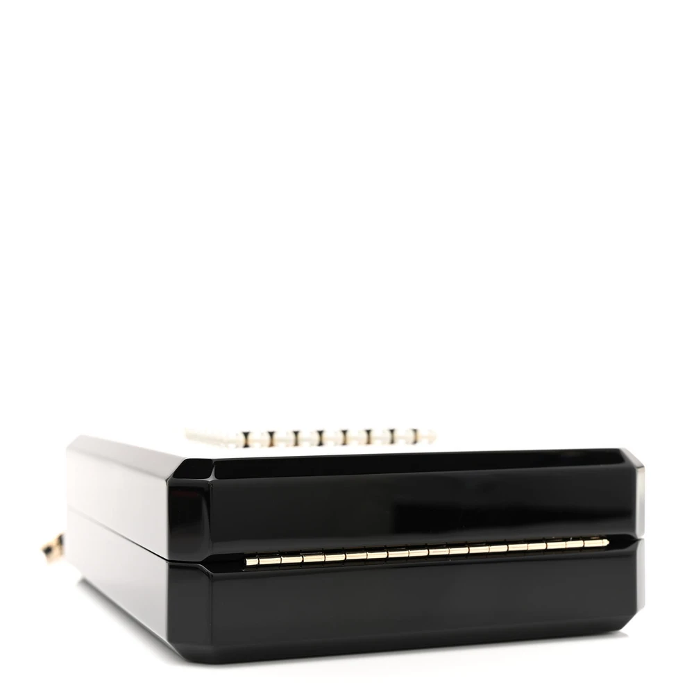 Bottom view of the black and gold plexiglass Perfume Bottle Clutch