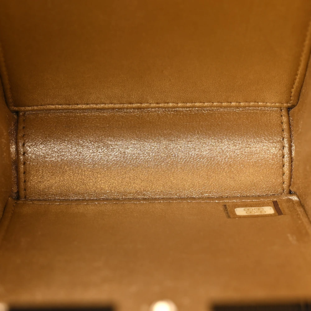 Interior view of the Perfume Bottle Clutch with leather lining and compact storage compartment