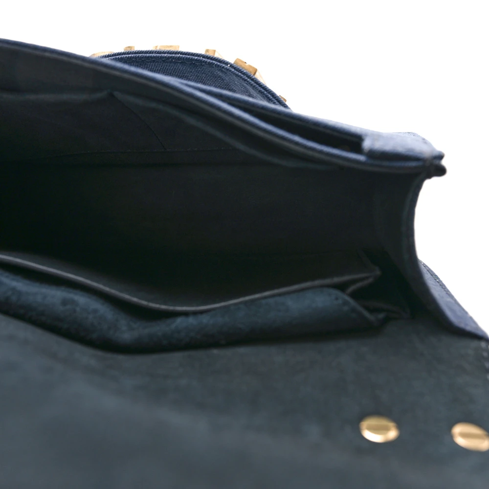 Interior view of the J'Adior Chain Flap bag with leather lining and organized storage compartments