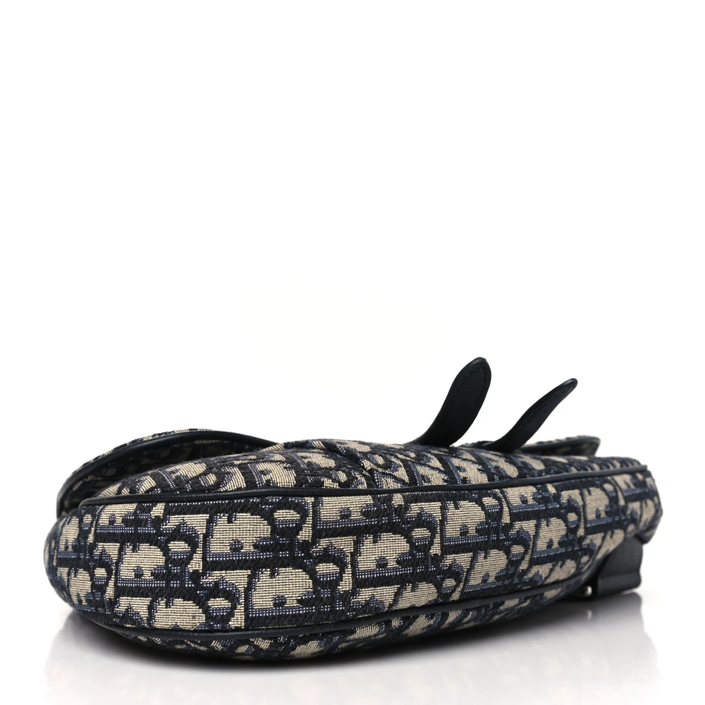 Bottom view of the blue Dior Oblique jacquard Men's Saddle Bag showing the structured base
