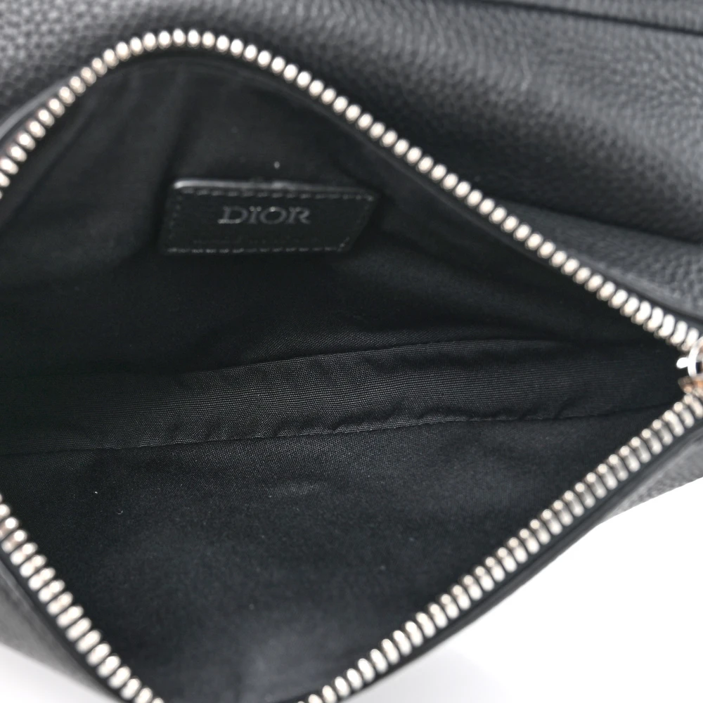 Close-up of Mini Saddle Bag black grained calfskin leather with gold-tone hardware