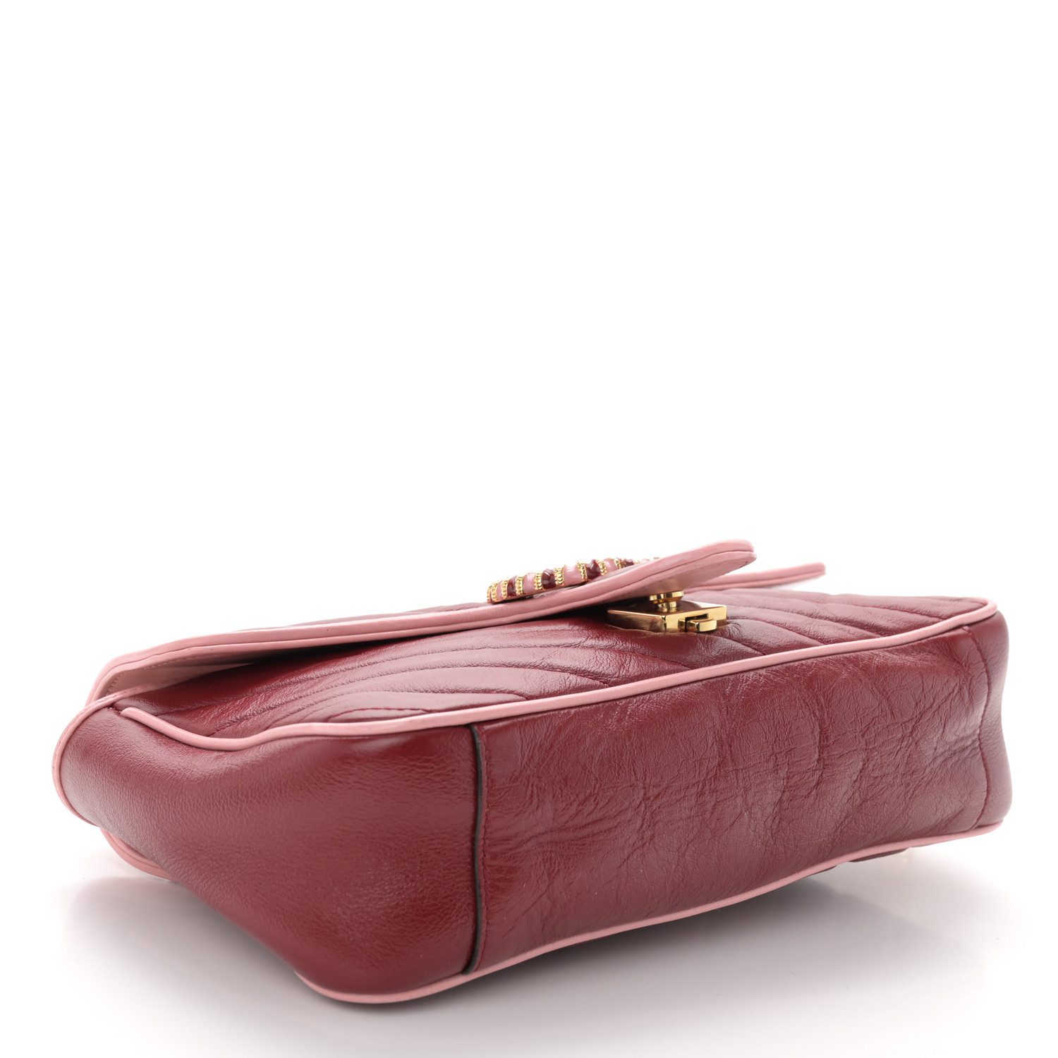 Bottom view of the GG Marmont Small Torchon shoulder bag showing the quilted leather base