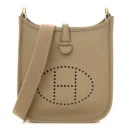 Front view of the Herme$ Taurillon Clemence Evelyne TPM in Beige Marfa
