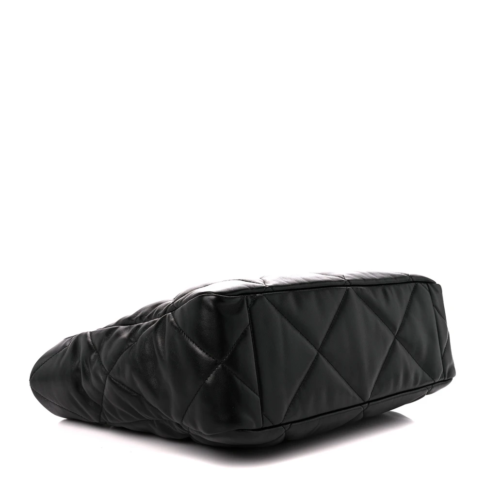 Bottom view of the black lambskin Chanel 19 East West Shopping Bag showing the structured leather base