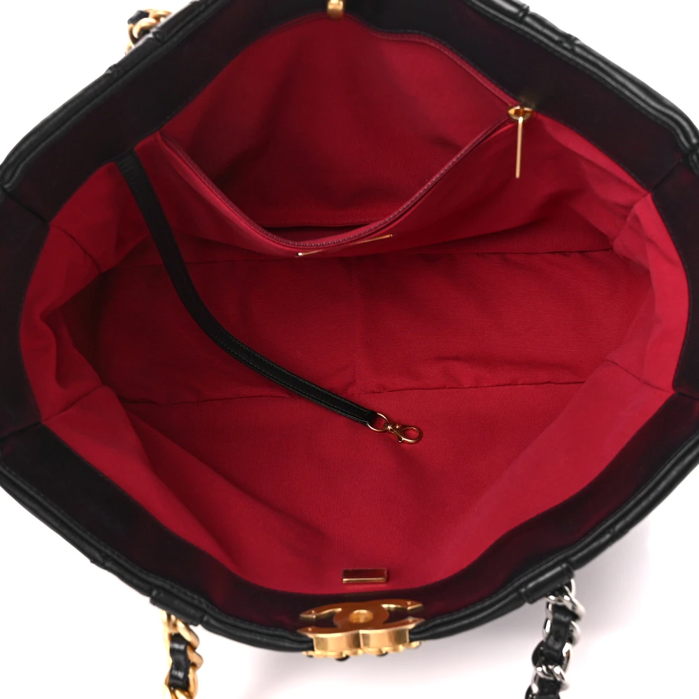 Interior view of the black lambskin Chanel 19 East West Shopping Bag with leather lining and organized compartments