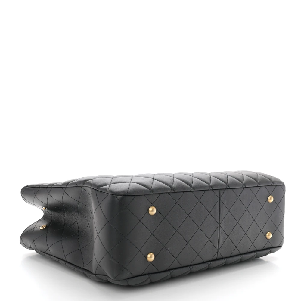Bottom view of the black quilted calfskin Large Classic Shopping Tote showing the structured leather base