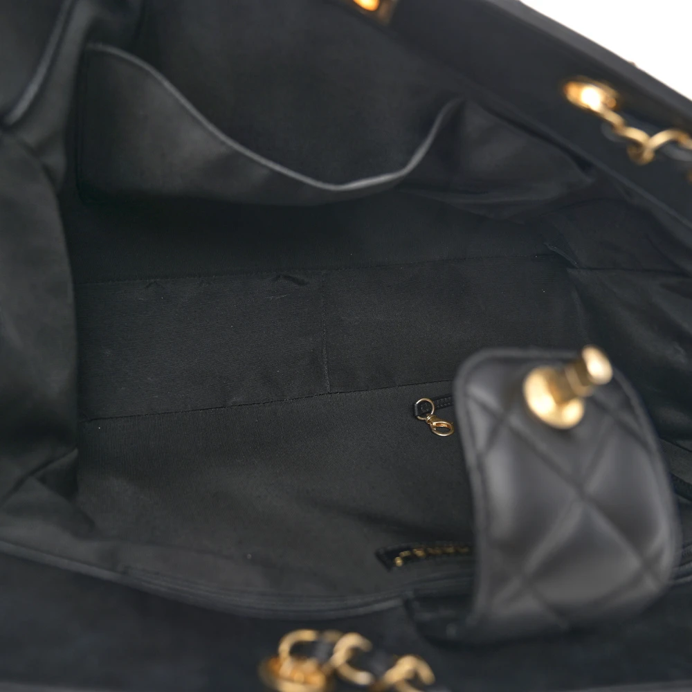 Interior view of the black quilted calfskin Large Classic Shopping Tote with leather lining and spacious compartments