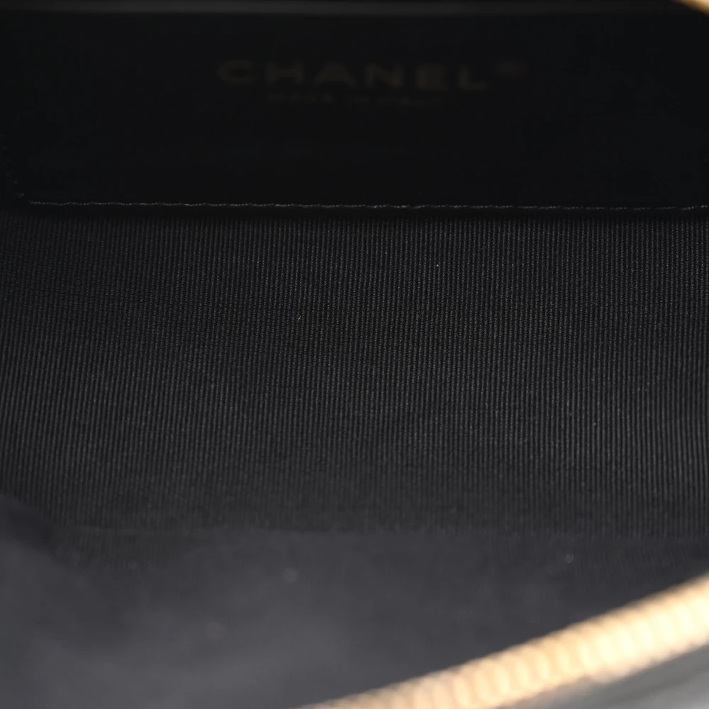 Interior view of the black caviar leather Mini Camera Case with leather lining and organized storage