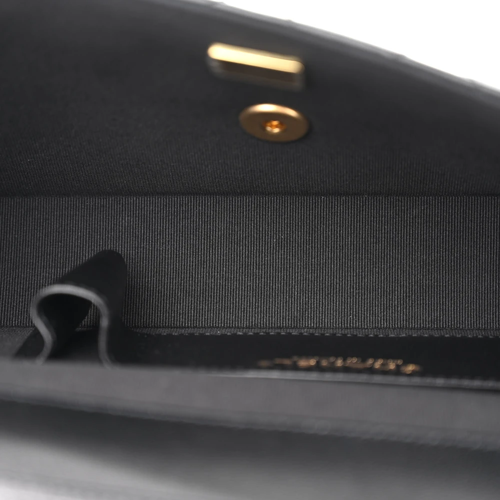 Interior view of the black lambskin Flap Clutch Bag with leather lining and organized compartments