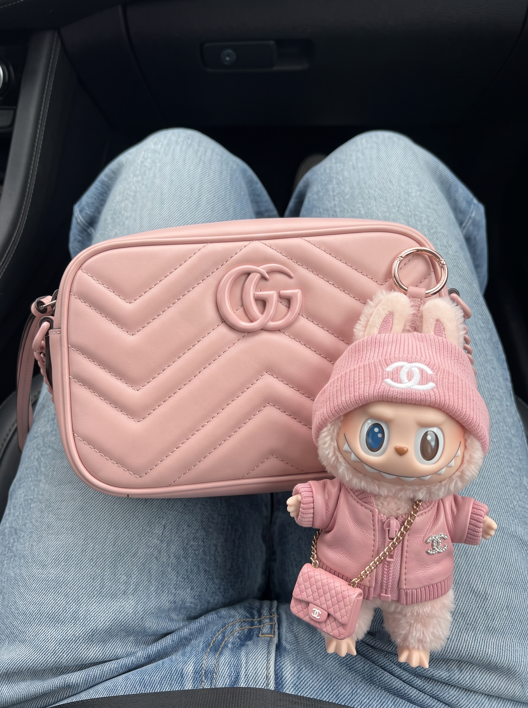 Model carrying a perfect pink matelassé calfskin Mini GG shoulder bag with gold-tone chain strap