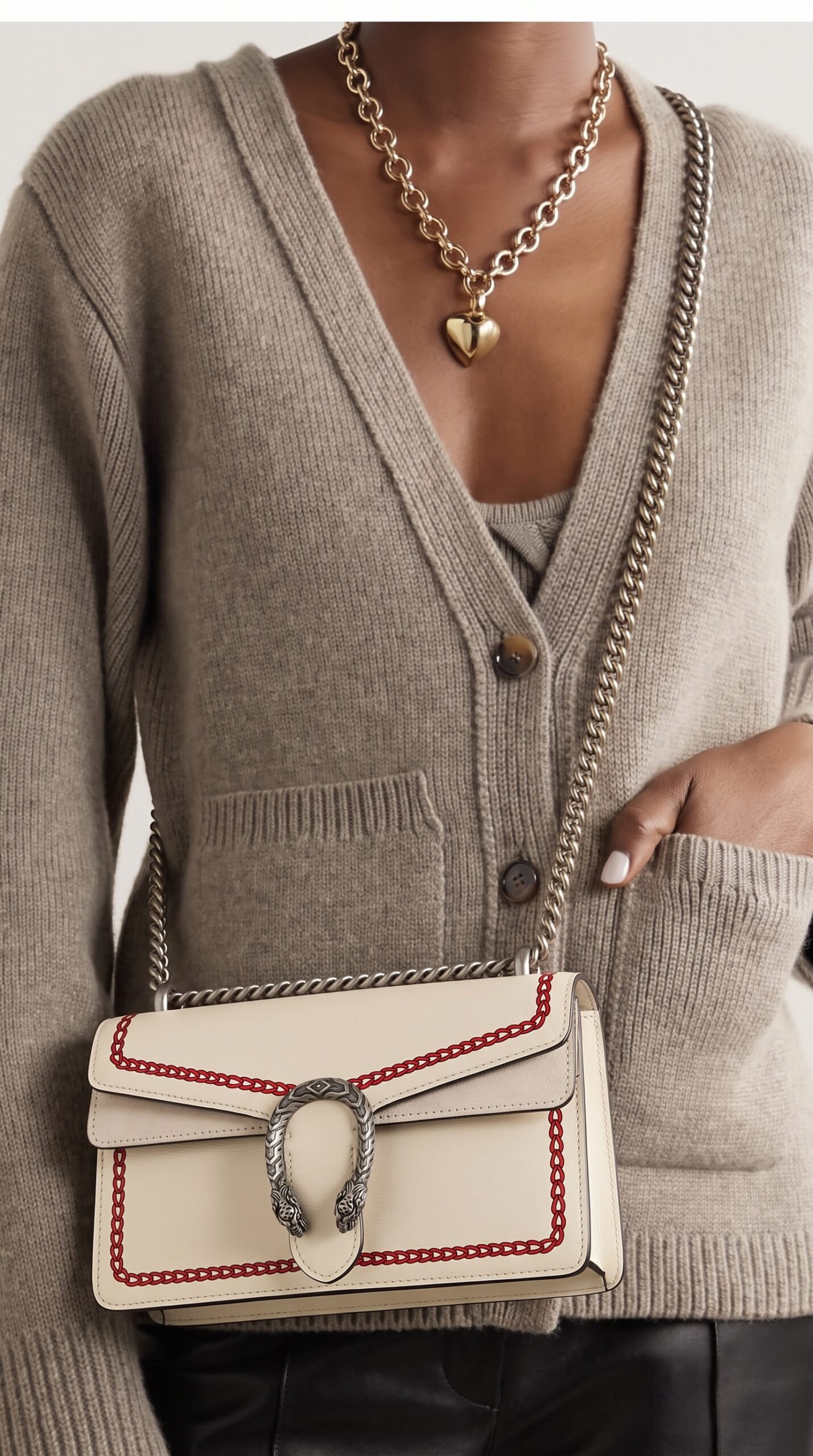 Model carrying the Gucc! Lunar New Year Small Dionysus Shoulder Bag in Mystic White and Red