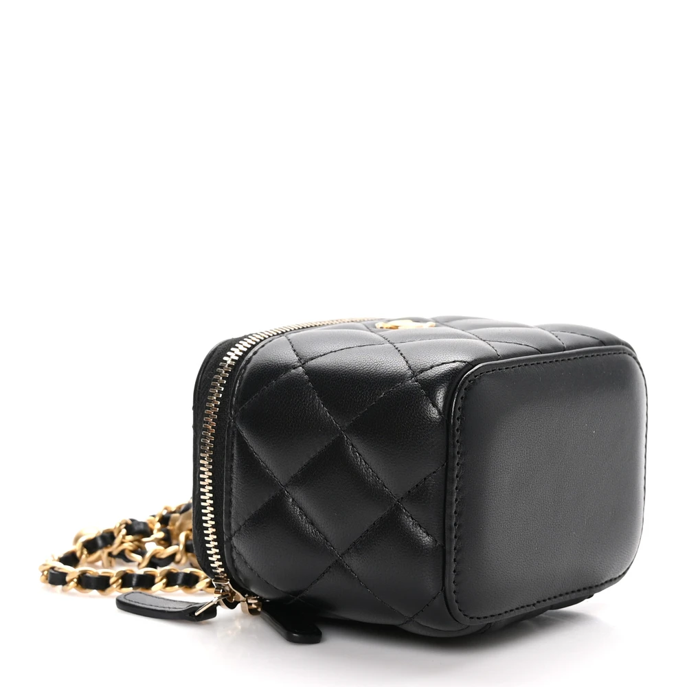 Bottom view of the black lambskin Pearl Crush Vanity Case showing the structured leather base