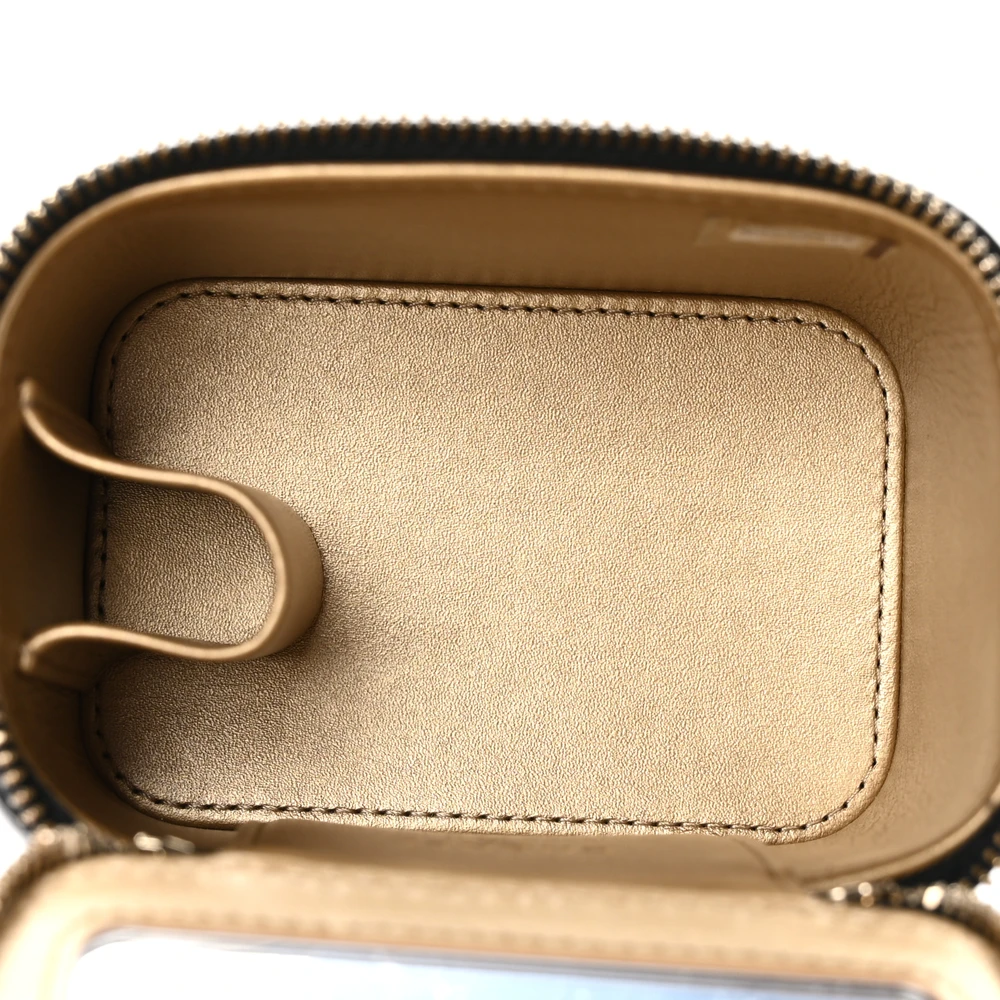 Interior view of the black lambskin Pearl Crush Vanity Case with leather lining and organized storage