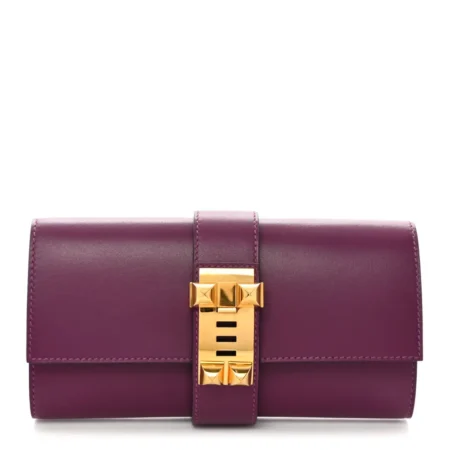 Front view of the Herme$ Tadelakt Medor 23 Clutch in Anemone with gold hardware